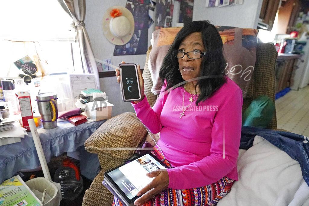 Rogelio V. Solis Mary Christian, 71, of McComb, Miss., recalls Friday, Jan. 15, 2021, the hours she spent on both her cell phone and iPad trying to arrange an appointment online for a COVID-19 vaccination through the Mississippi State Department of Health website and on their listed registration phone line. Eventually, with help from one of her sons, she was able to enter the registration site only to find vaccination locations with openings were at least an hour's drive from the county she lives in and upon trying to sign up was informed they had no more openings. (AP Photo/Rogelio V. Solis)