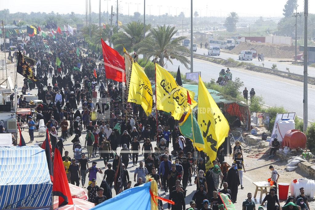 Anmar Khalil Shiite pilgrims arrive Karbala, Iraq, for the Arbaeen ritual Tuesday, Oct. 6, 2020. Arbaeen holiday marks the end of the forty day mourning period after the anniversary of the martyrdom of Imam Hussein, the Prophet Muhammad's grandson in the 7th century. (AP Photo/Anmar Khalil)(AP Photo/Anmar Khalil)