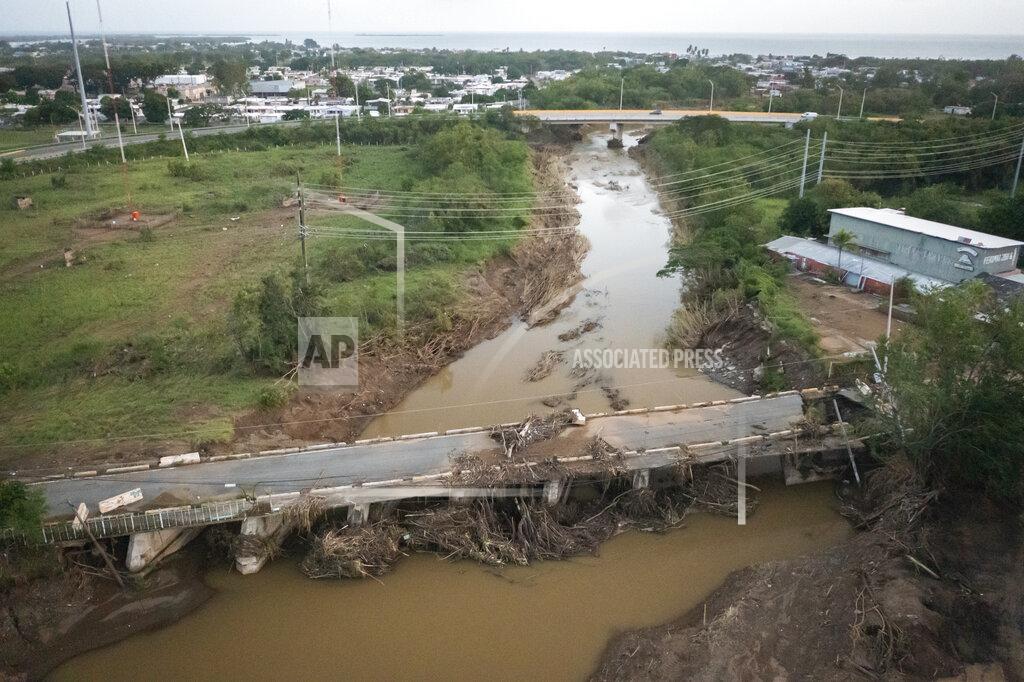 Alejandro Granadillo View of a damaged bridge after Hurricane Fiona hit Villa Esperanza in Salinas, Puerto Rico, Wednesday, September 21, 2022. (AP Photo/Alejandro Granadillo)