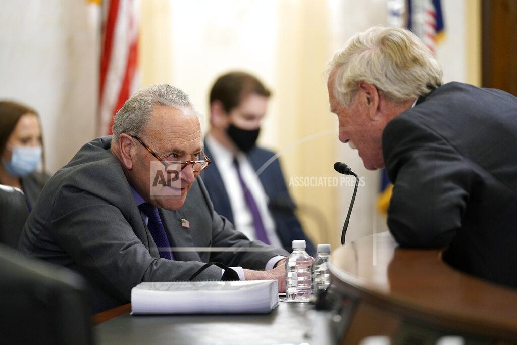 J. Scott Applewhite Senate Majority Leader Chuck Schumer of N.Y., and Sen. Angus King, I-Maine, speak before a Senate Rules Committee hearing at the Capitol in Washington, Tuesday, May 11, 2021. (AP Photo/J. Scott Applewhite)
