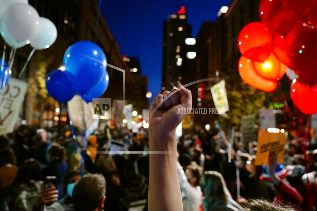 People urging that all votes be counted demonstrate outside the Pennsylvania Convention Center where votes are being counted, Thursday, Nov. 5, 2020, in Philadelphia, following Tuesday's election. (AP Photo/Matt Slocum)