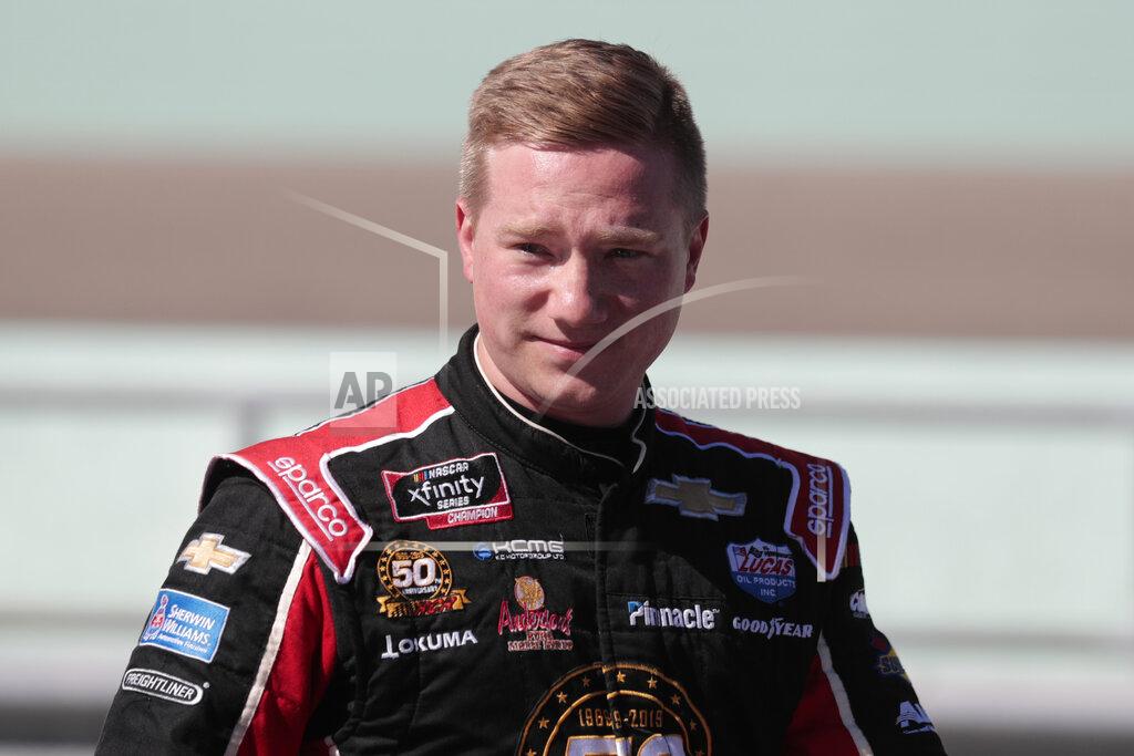 Luis M. Alvarez Tyler Reddick poses is seen in the pits after winning the pole position for the NASCAR Xfinity Series auto racing championship at Homestead-Miami Speedway in Homestead, Fla. Saturday, Nov. 16, 2019. (AP Photo/Luis M. Alvarez)
