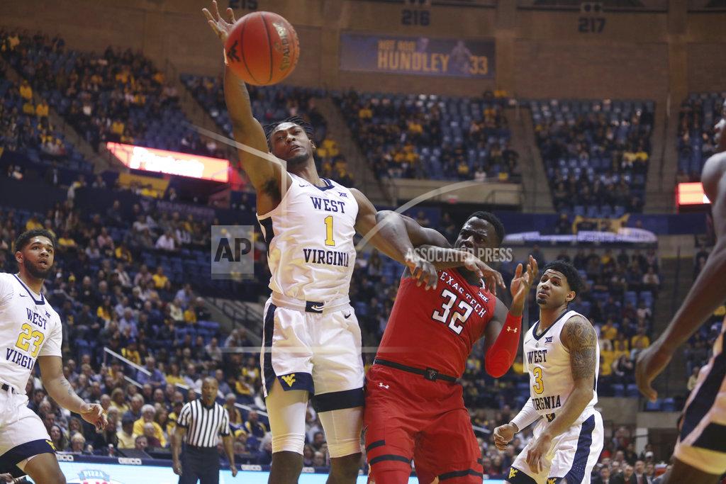 Ray Thompson West Virginia forward Derek Culver (1) rebounds the ball while defended by Texas Tech center Norense Odiase (32) during the first half of an NCAA college basketball game Wednesday, Jan. 2, 2019, in Morgantown, W.Va. (AP Photo/Raymond Thompson)