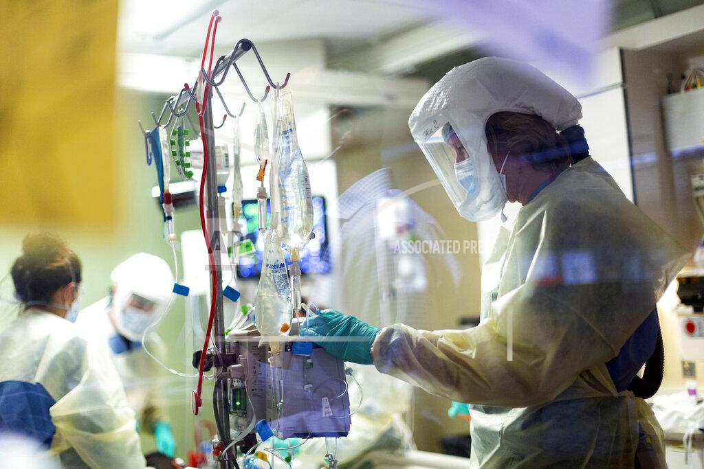Kyle Green FILE - In this Aug. 31, 2021, file photo, Jack Kingsley R.N. attends to a COVID-19 patient in the Medical Intensive care unit (MICU) at St. Luke's Boise Medical Center in Boise, Idaho. The summer that was supposed to mark America’s independence from COVID-19 is instead drawing to a close with the U.S. more firmly under the tyranny of the virus, with deaths per day back up to where they were in March 2021. (AP Photo/Kyle Green, File)