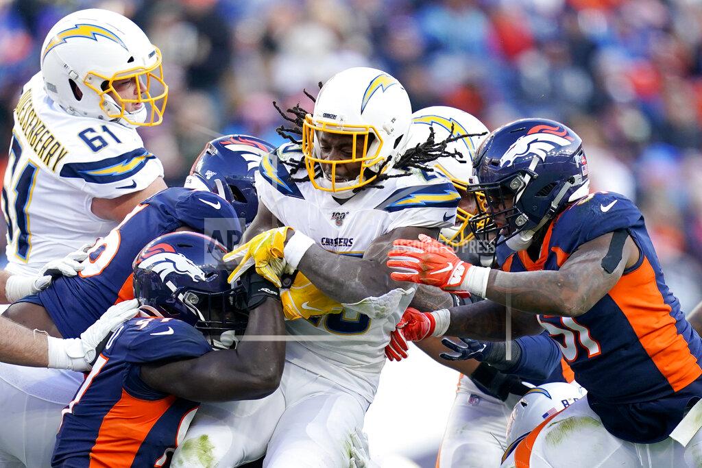 Jack Dempsey Los Angeles Chargers running back Melvin Gordon is tackled by the against the Denver Broncos during the first half of an NFL football game Sunday, Dec. 1, 2019, in Denver. (AP Photo/Jack Dempsey)