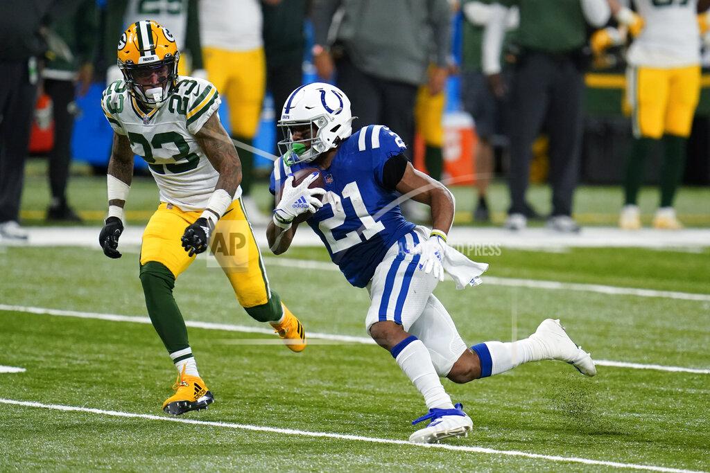 Michael Conroy Indianapolis Colts' Nyheim Hines (21) is chased by Green Bay Packers' Jaire Alexander (23) during the second half of an NFL football game, Sunday, Nov. 22, 2020, in Indianapolis. (AP Photo/Michael Conroy)