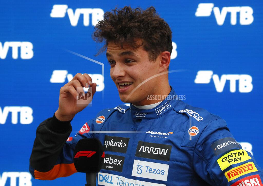 Yuri Kochetkov McLaren's British driver Lando Norris celebrates taking the pole position after the qualifying session for the Formula One Russian Grand Prix at the Sochi Autodrom circuit, Russia, Saturday, Sept. 25, 2021. The Russian Formula One Grand Prix will be held on Sunday. (Yuri Kochetkov/Pool Photo via AP)
