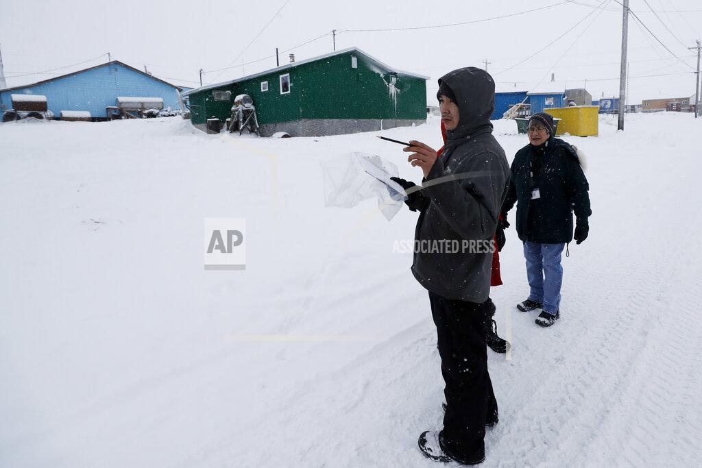 Gregory Bull FILE - In this Jan. 20, 2020, file photo, census workers verify that their maps match up to the right amount of houses in Toksook Bay, Alaska, a mostly Yup'ik village on the edge of the Bering Sea. Alaska's population grew by 23,160 people, or 3.3%, in the last decade, according to the first numbers released Monday for the 2020 Census. (AP Photo/Gregory Bull, File)
