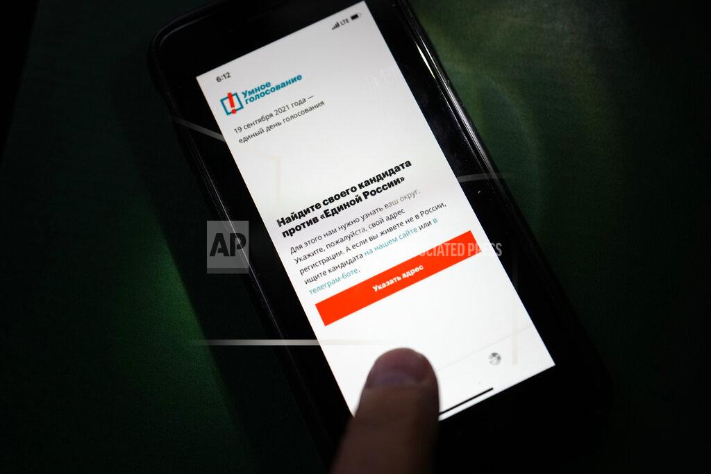 Alexander Zemlianichenko The app Smart Voting is displayed on an iPhone screen in Moscow, Russia, Friday, Sept. 17, 2021. Facing Kremlin pressure, Apple and Google on Friday removed from their online stores an opposition-created smartphone app that tells voters which candidates are likely to defeat those backed by Russian authorities, as polls opened in Russia's parliamentary election. (AP Photo/Alexander Zemlianichenko)