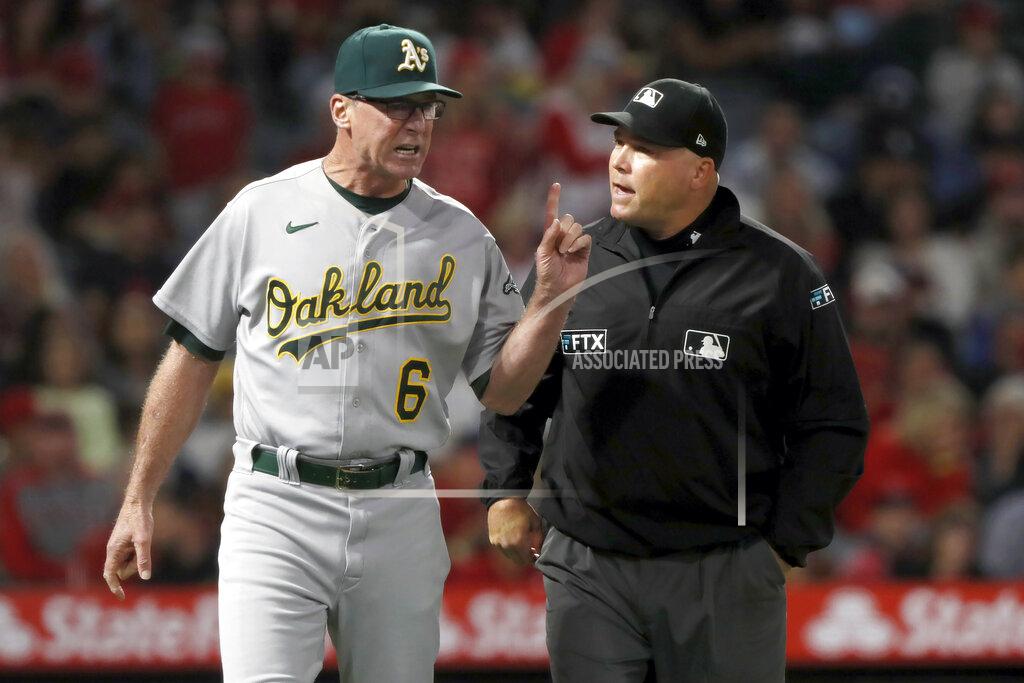 Alex Gallardo Oakland Athletics manager Bob Melvin, left, questions umpire Mark Carlson on a video replay decision during the seventh inning of the team's baseball game against the Los Angeles Angels in Anaheim, Calif., Saturday, Sept. 18, 2021. (AP Photo/Alex Gallardo)