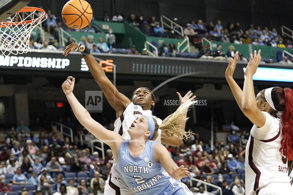 Gerry Broome South Carolina forward Aliyah Boston, top left, blocks North Carolina guard Carlie Littlefield (2) during the first half of a college basketball game in the Sweet 16 round of the NCAA tournament in in Greensboro, N.C., Friday, March 25, 2022. (AP Photo/Gerry Broome)