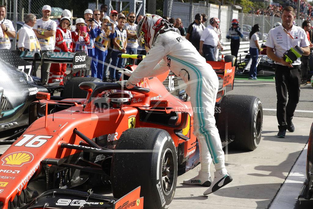 Luca Bruno Mercedes driver Lewis Hamilton of Britain, right, congratulates Ferrari driver Charles Leclerc of Monaco winning the Formula One Italy Grand Prix at the Monza racetrack, in Monza, Italy, Sunday, Sept. 8, 2019. (AP Photo/Luca Bruno)