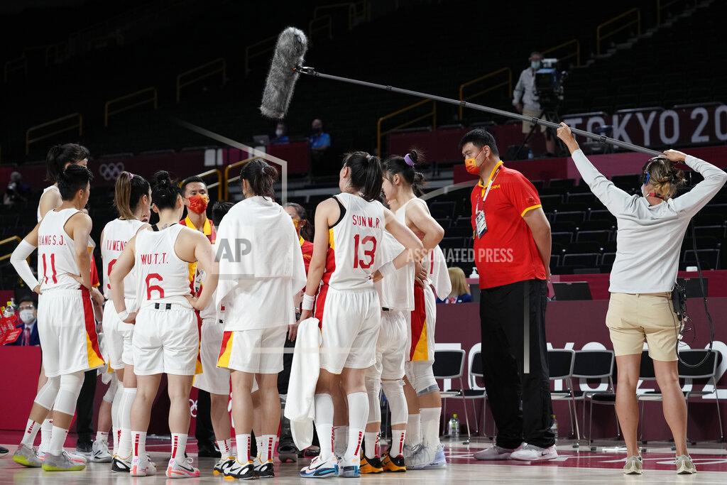Eric Gay China's Yao Ming, second from right, stands in the huddle with the women's team during a timeout in a women's basketball quarterfinal game against Serbia at the 2020 Summer Olympics, Wednesday, Aug. 4, 2021, in Saitama, Japan. (AP Photo/Eric Gay)