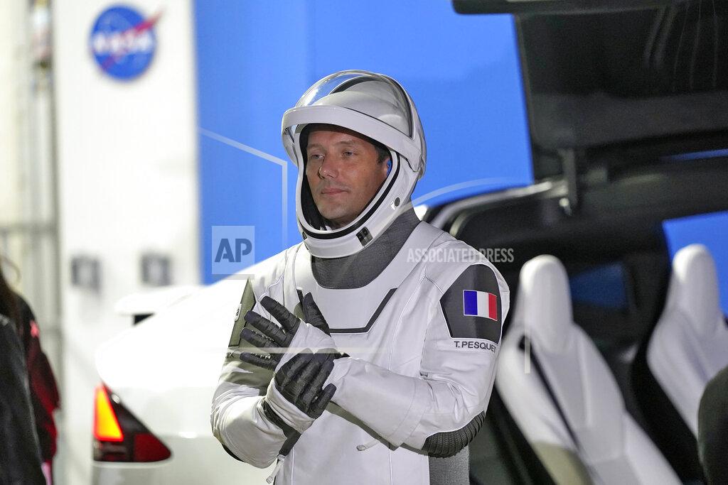 John Raoux European Space Agency astronaut Thomas Pesquet of France, adjusts his glove as he talks to family and friends before a launch attempt Friday, April 23, 2021, at the Kennedy Space Center in Cape Canaveral, Fla. Four astronauts will fly on the SpaceX Crew mission to the International Space Station scheduled for launch on April 23, 2021. (AP Photo/John Raoux)