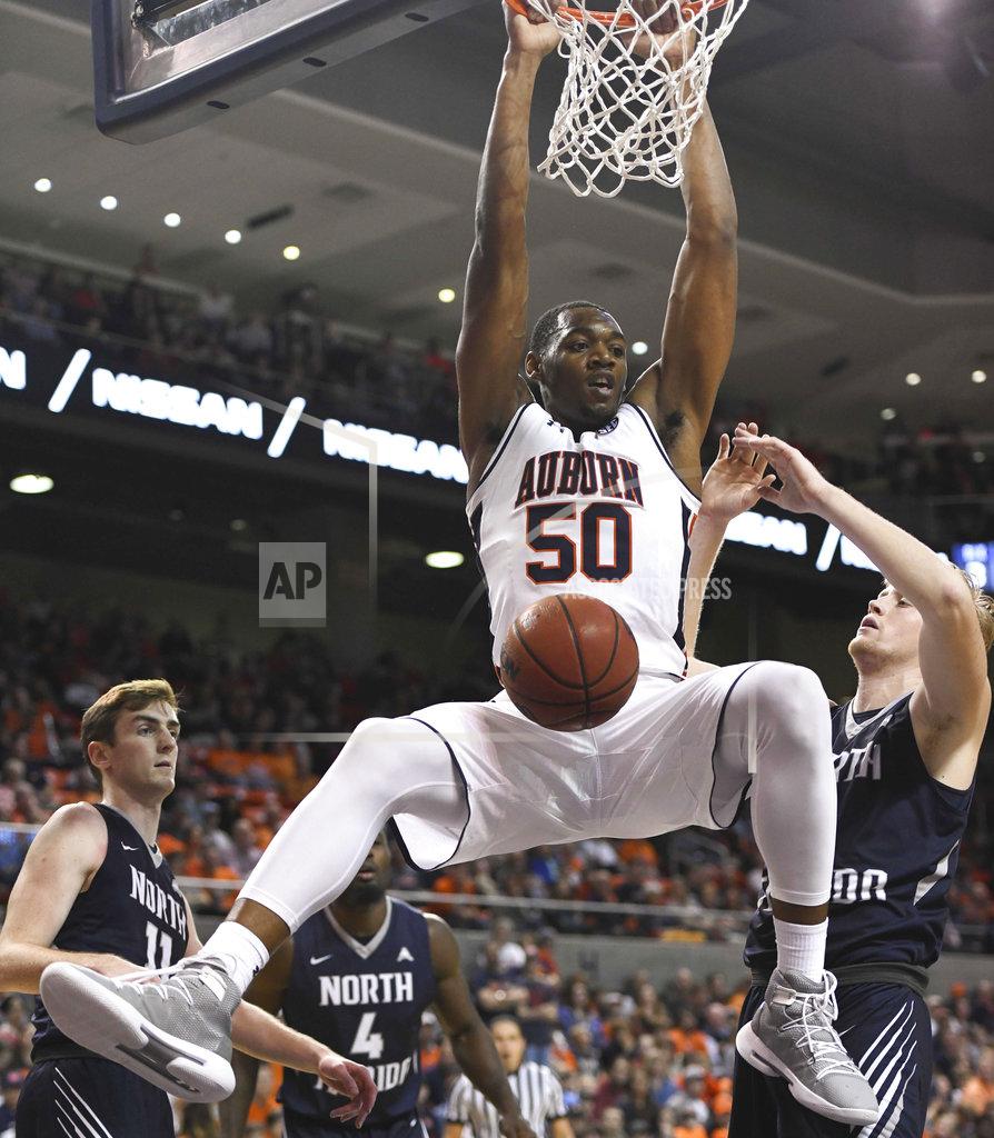 Julie Bennett Auburn center Austin Wiley (50) dunks against North Florida during the second half of an NCAA college basketball game Saturday, Dec. 29, 2018, in Auburn, Ala. (AP Photo/Julie Bennett)