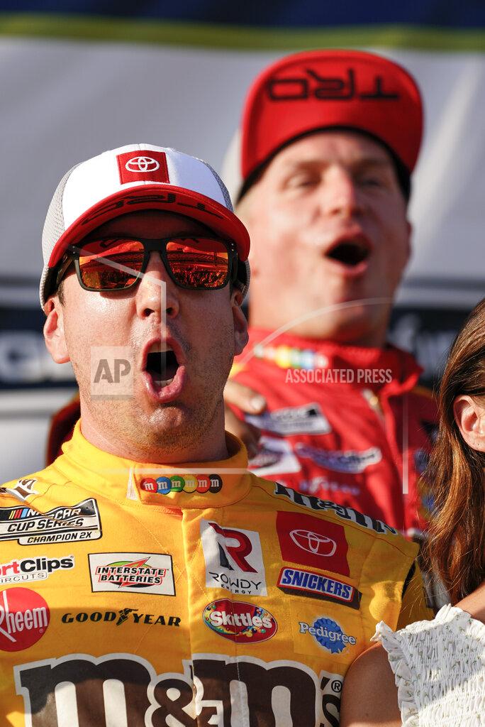 Matt Slocum Kyle Busch, left, celebrates with teammates after winning a NASCAR Cup Series auto race at Pocono Raceway, Sunday, June 27, 2021, in Long Pond, Pa. (AP Photo/Matt Slocum)