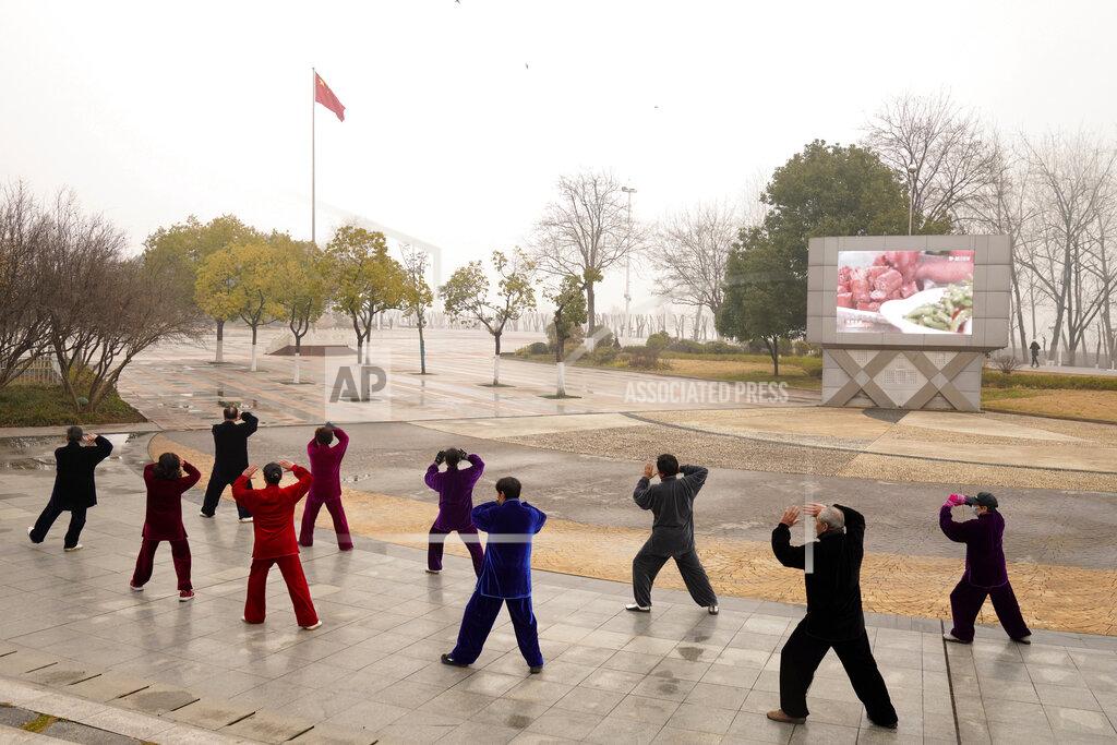 Ng Han Guan Residents practice tai chi at a park in Wuhan in central China's Hubei Province on Saturday, Jan. 23, 2021. A year after it was locked down to contain the spread of coronavirus, the central Chinese city of Wuhan has largely returned to normal, even as China continues to battle outbreaks elsewhere in the country. (AP Photo/Ng Han Guan)