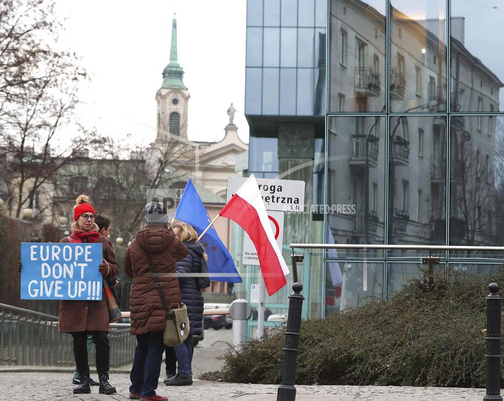 Czarek Sokolowski FILE - In this Jan. 28, 2020, file photo, demonstrators protest against Poland's government's efforts to control the court system in front of the Supreme Court in Warsaw, Poland. The European Union still hasn't completely sorted out its messy post-divorce relationship with Britain — but it has already been plunged into another major crisis. This time the 27-member union is being tested as Poland and Hungary block passage of its budget for the next seven years and an ambitious package aimed at rescuing economies ravaged by the coronavirus pandemic. (AP Photo/Czarek Sokolowski, File)
