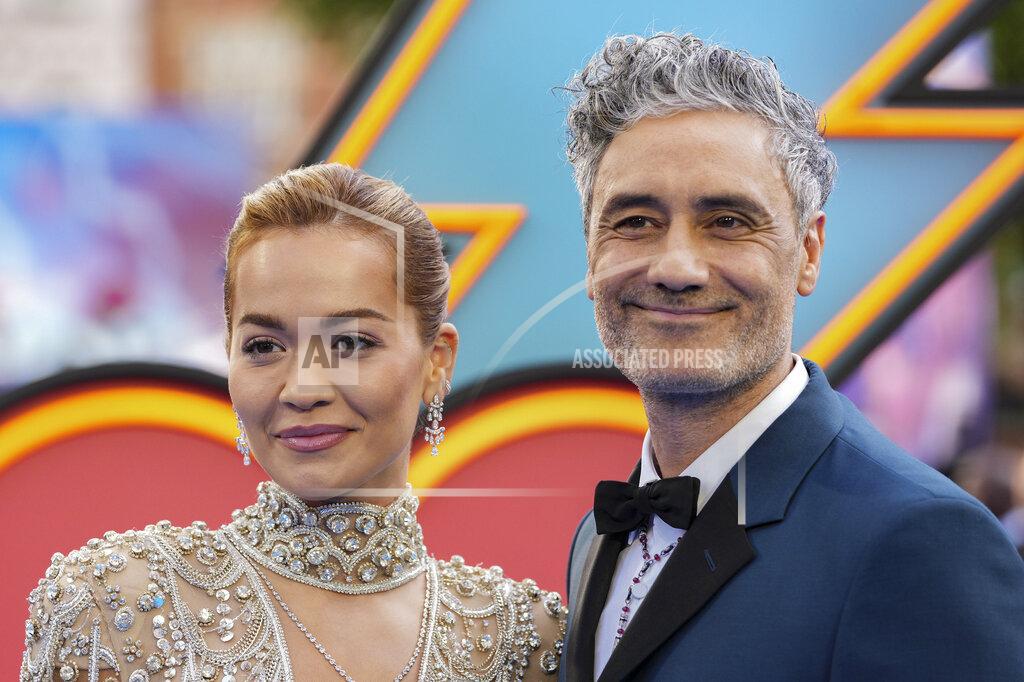 Scott Garfitt Director Taika Waititi, right, and Rita Ora pose for photographers upon arrival at the screening of the film 'Thor: Love and Thunder in London Tuesday, July 5, 2022. (AP Photo/Scott Garfitt)