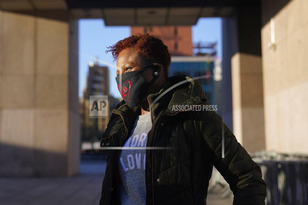 Seth Wenig Carla Brown, executive director of the Charles A. Walburg Multi-Service Organization, waits for the arrival of vans that will make meals-on-wheels deliveries in upper Manhattan, New York, Wednesday, March 3, 2021. “It’s been the longest year of my life,” said Brown, whose meals-on-wheels program was swamped last spring when New York’s lockdown stranded many of the city’s elderly. (AP Photo/Seth Wenig)