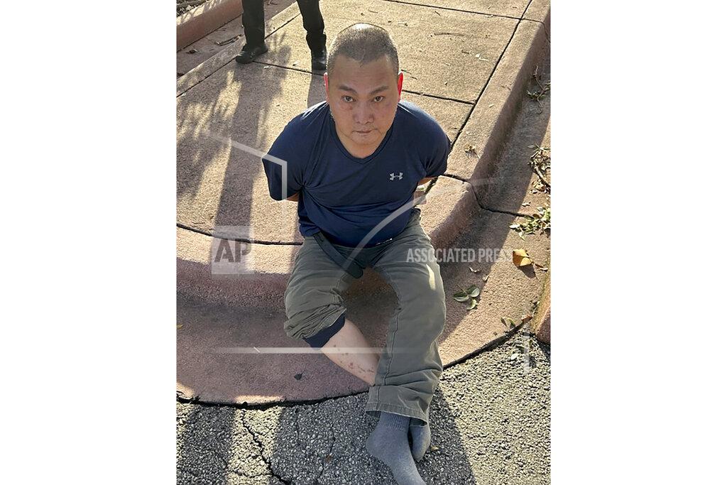 Uncredited This photo released by the U.S. Marshals Service shows Wu Chen following his arrest by the Miami Beach Police on Tuesday, Nov. 22, 2022, in South Florida. Police said Wu is a suspect in the weekend killings of four people at a marijuana farm in Oklahoma. (U.S. Marshals Service via AP)