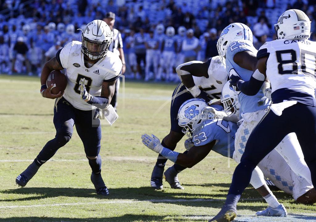 Gerry Broome Georgia Tech Tobias Oliver (8) runs for a touchdown during the second half of an NCAA college football game against North Carolina in Chapel Hill, N.C., Saturday, Nov. 3, 2018. Georgia Tech won 38-28. (AP Photo/Gerry Broome)