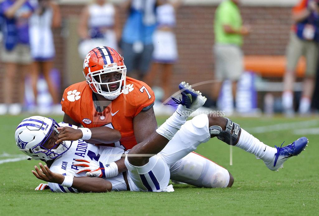 Richard Shiro Furman quarterback Darren Grainger knocked down by Clemson's Austin Bryant after scrambling out of the pocket during the first half of an NCAA college football game Saturday, Sept. 1, 2018, in Clemson, S.C. (AP Photo/Richard Shiro)