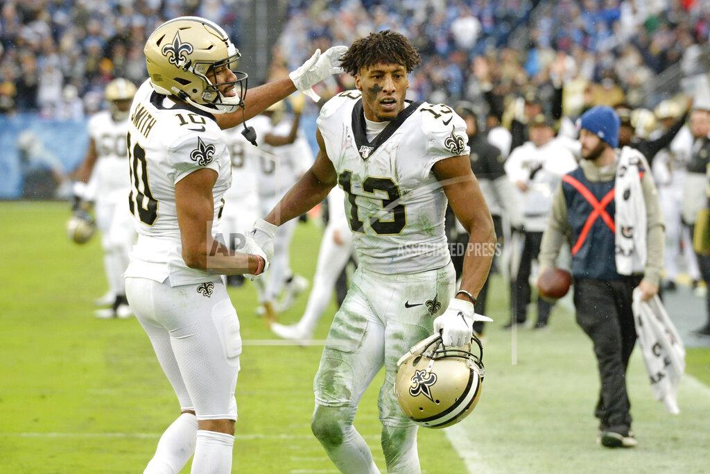Mark Zaleski New Orleans Saints wide receiver Michael Thomas (13) is congratulated by Tre'Quan Smith (10) after Thomas made a catch against the Tennessee Titans in the second half of an NFL football game Sunday, Dec. 22, 2019, in Nashville, Tenn. The catch gave Thomas the NFL single-season pass reception record. (AP Photo/Mark Zaleski)