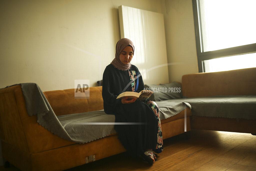 Emrah Gurel Uyghur Nursimangul Abdureshid, 34, poses for a photograph during an interview with The Associated Press in Istanbul, Turkey on May 4, 2022. Nearly one in 25 people in a county in the Uyghur heartland of China has been sentenced to prison on terrorism-related charges, in what is the highest known imprisonment rate in the world, an Associated Press review of leaked data shows. Abdureshid's brother, Memetali Abdureshid, who ran a car repair shop, was listed as being sentenced to 15 years and 11 months in prison on charges of "picking quarrels and provoking trouble” and “preparing to carry out terrorist activities." (AP Photo/Emrah Gurel)