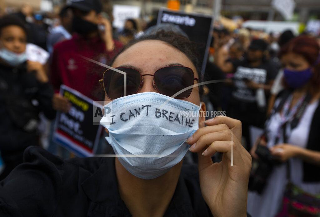 Peter Dejong People take part in a Black Lives Matter protest in Amsterdam, Netherlands, Monday, June 1, 2020, to protest against the recent killing of George Floyd, a black man who died in police custody in Minneapolis, U.S.A., after being restrained by police officers on Memorial Day. (AP Photo/Peter Dejong)