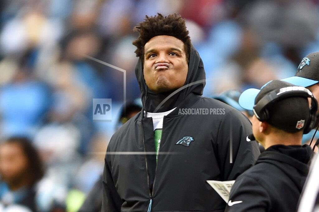 Mike Mccarn FILE - In this Dec. 23, 2018, file photo, Carolina Panthers' Cam Newton watches the action from the sidelines during the second half of an NFL football game against the Atlanta Falcons, in Charlotte, N.C. Cam Newton is a former league MVP and the long-time face of the Panthers franchise. But it's hard not to wonder if his future in Carolina is coming to an end following his recent spate of injuries. (AP Photo/Mike McCarn, File)