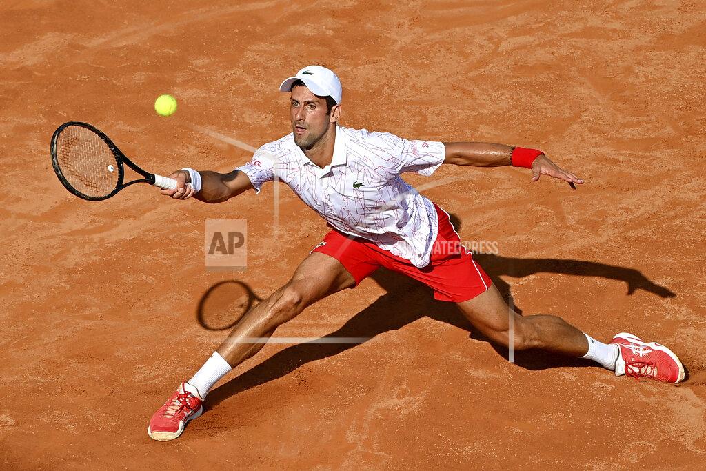 Alfredo Falcone Serbia's Novak Djokovic returns the ball to Serbia's Filip Krajnovic during their Italian Open tennis tournament match, in Rome, Friday, Sept. 18, 2020. (Alfredo Falcone/LaPresse via AP)