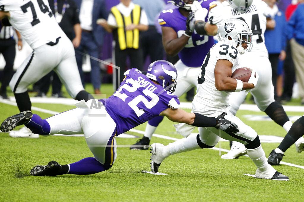 Bruce Kluckhohn Oakland Raiders running back DeAndre Washington (33) is tackled by Minnesota Vikings free safety Harrison Smith (22) during the first half of an NFL football game, Sunday, Sept. 22, 2019, in Minneapolis. (AP Photo/Bruce Kluckhohn)