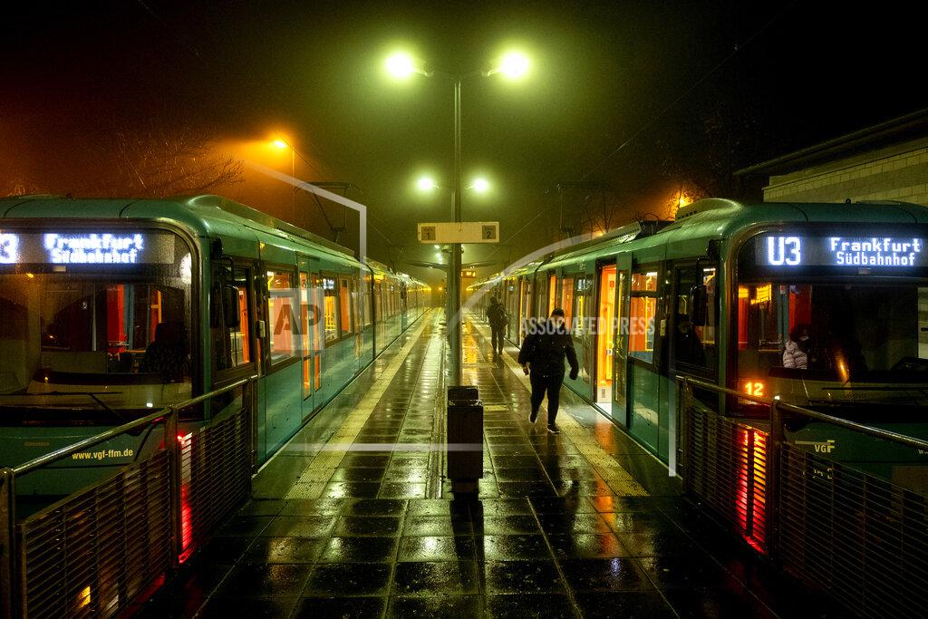 Michael Probst FILE - In this Thursday, Nov. 12, 2020 file photo, a woman walks away from a subway station in Oberursel near Frankfurt, Germany, as the numbers of new Coronavirus infections went over 20,000 again. More than 50,000 people have died after contracting COVID-19 in Germany, a number that has risen swiftly over recent weeks as the country has struggled to bring down infection figures. (AP Photo/Michael Probst, file)