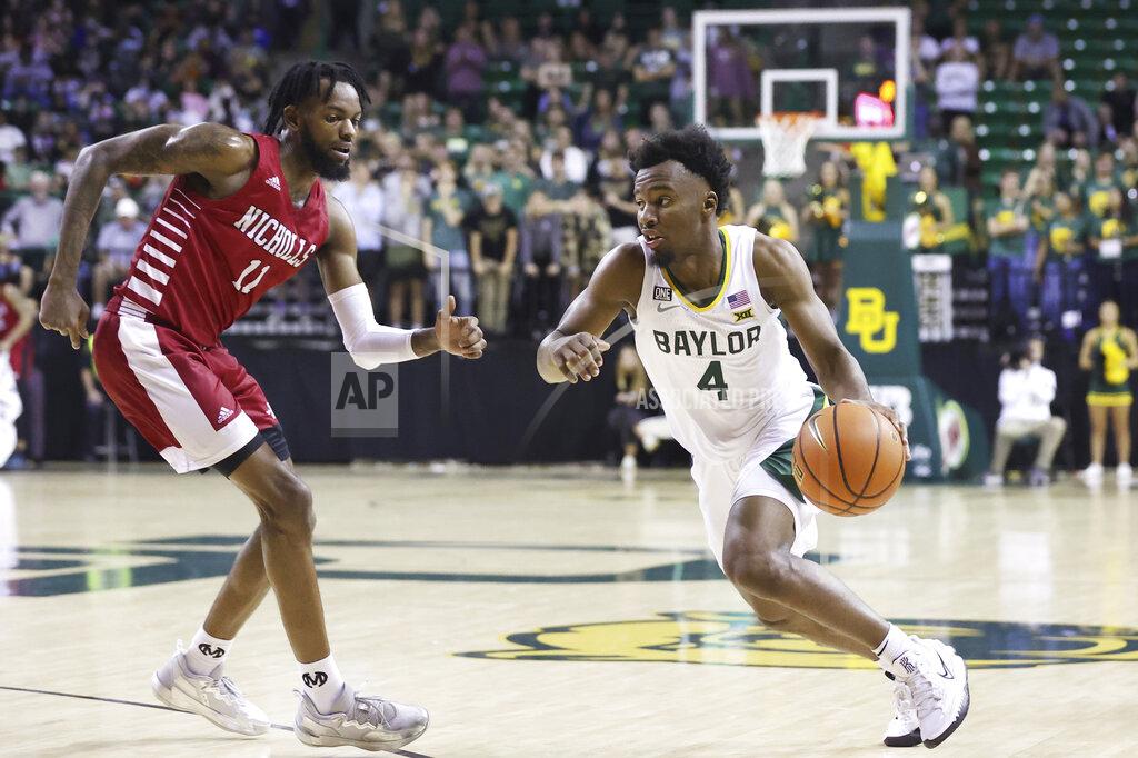 Rod Aydelotte Baylor guard LJ Cryer (4) drives against Nicholls State guard Latrell Jones (11) in the second half of an NCAA college basketball game, Monday, Nov. 15, 2021, in Waco, Texas. (AP Photo/Rod Aydelotte)