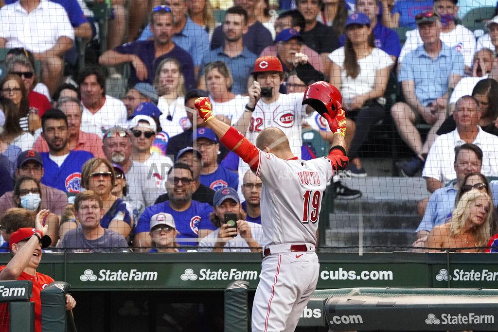 David Banks Cincinnati Reds' Joey Votto gestures while returning to the dugout after hitting a home run against the Chicago Cubs during the third inning of a baseball game Tuesday, July 27, 2021, in Chicago. (AP Photo/David Banks)