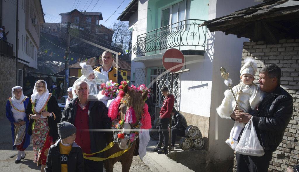 Jordan Simeonov Families prepare to take part in a mass circumcision ceremony in the village of Ribnovo, Bulgaria, Sunday, April 11, 2021. Despite the dangers associated with COVID-19 and government calls to avoid large gatherings, Hundreds of people flocked to the tiny village of Ribnovo in southwestern Bulgaria for a four-day festival of feasting, music and the ritual of circumcision which is considered by Muslims a religious duty and essential part of a man's identity. (AP Photo/Jordan Simeonov)