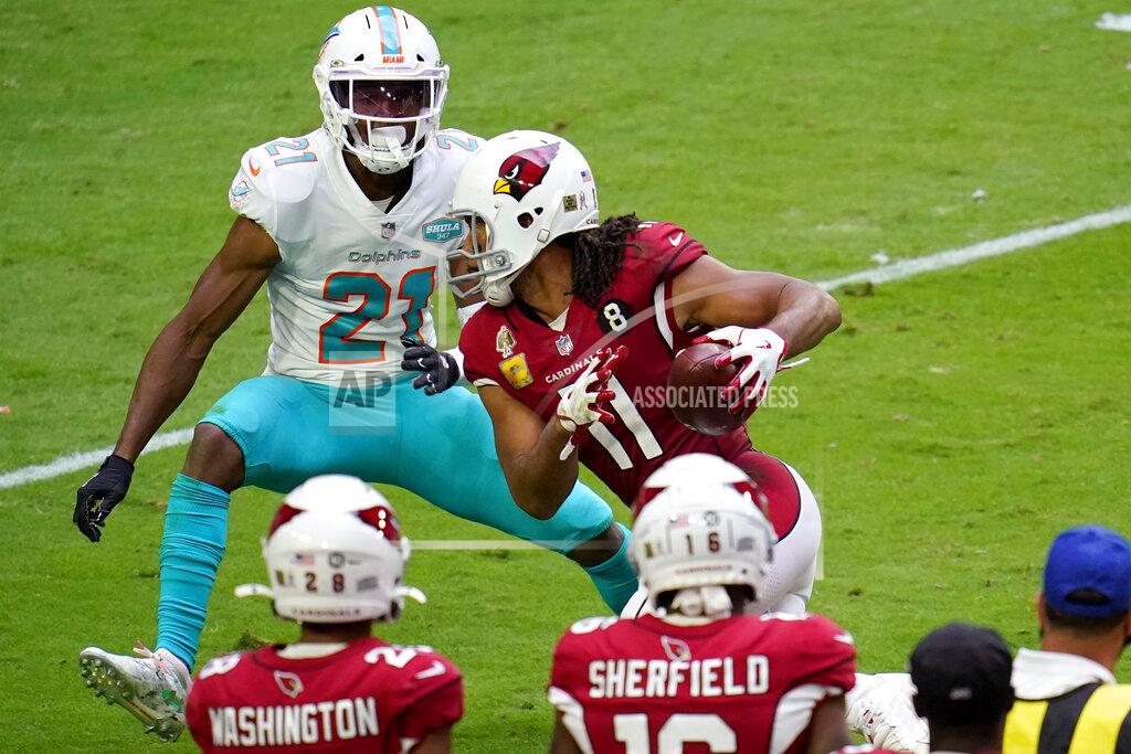 Ross D. Franklin Arizona Cardinals wide receiver Larry Fitzgerald (11) runs the ball after the catch as Miami Dolphins free safety Eric Rowe (21) defends during the first half of an NFL football game, Sunday, Nov. 8, 2020, in Glendale, Ariz. (AP Photo/Ross D. Franklin)