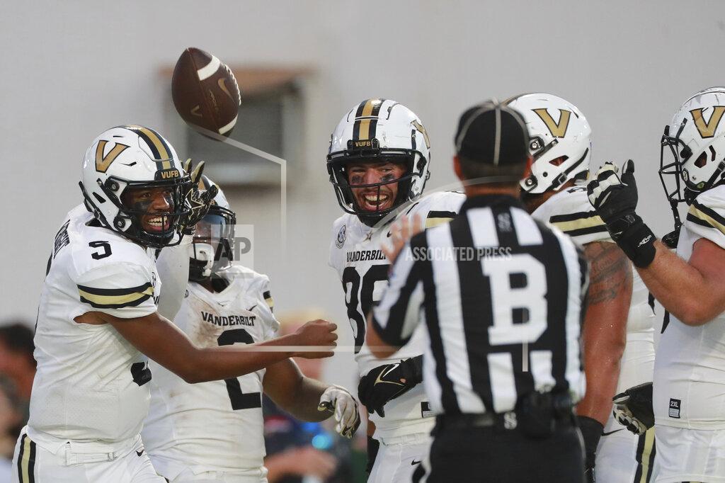 Marco Garcia The Vanderbilt offensive line reacts after running back Re'Mahn Davis (2) made a touchdown over Hawaii during the second half of an NCAA college football game, Saturday, Aug. 27, 2022, in Honolulu. (AP Photo/Marco Garcia)