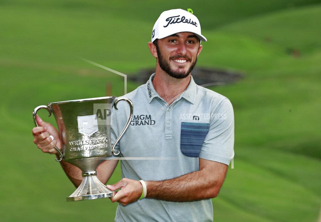 Jason E. Miczek FILE - In this May 5, 2019, file photo, Max Homa poses with the trophy after winning the Wells Fargo Championship golf tournament at Quail Hollow Club in Charlotte, N.C. Homa will have to wait two years to defend his title at Quail Hollow because the tournament moves to Bethesda, Md., next year. (AP Photo/Jason E. Miczek, File)