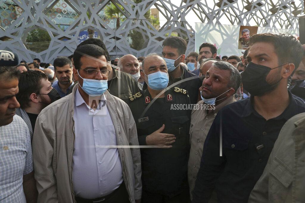 Vahid Salemi Iran's Revolutionay Guard commander Gen. Hossein Salami, center, attend the funeral ceremony of the Guard's Col. Hassan Sayyad Khodaei in Tehran, Iran, Tuesday, May 24, 2022. Iran's hard-line President Ebrahim Raisi vowed revenge on Monday over the killing of Sayyad Khodaei who was shot at his car by two assailants outside his home in Tehran, a still-mysterious attack on the country's powerful paramilitary force. (AP Photo/Vahid Salemi)