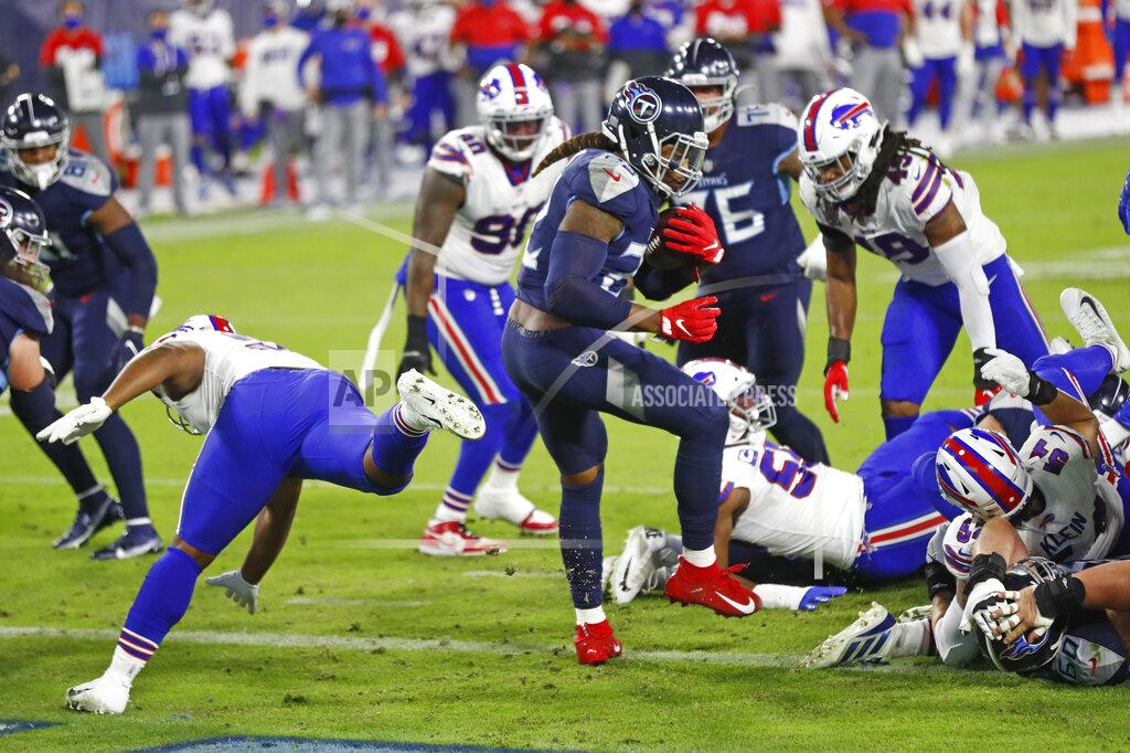 Wade Payne Tennessee Titans running back Derrick Henry (22) scores a touchdown against the Buffalo Bills in the first half of an NFL football game Tuesday, Oct. 13, 2020, in Nashville, Tenn. (AP Photo/Wade Payne)