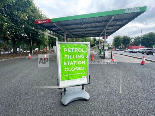 A closed petrol station in Bristol, England, Saturday Sept. 25, 2021. The haulage industry says the U.K. is short tens of thousands of truckers, due to a perfect storm of factors including the coronavirus pandemic, an aging workforce and an exodus of European Union workers following Britain’s departure from the bloc. BP and Esso shut a handful of their gas stations this week, and motorists have formed long lines as they try to fill up in case of further disruption. (Ben Birchall/PA via AP)