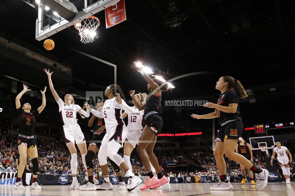 Young Kwak Stanford forward Cameron Brink (22) puts up a shot as Maryland forward Mimi Collins (2) defends during the first half of a college basketball game in the Sweet 16 round of the NCAA tournament, Friday, March 25, 2022, in Spokane, Wash. (AP Photo/Young Kwak)