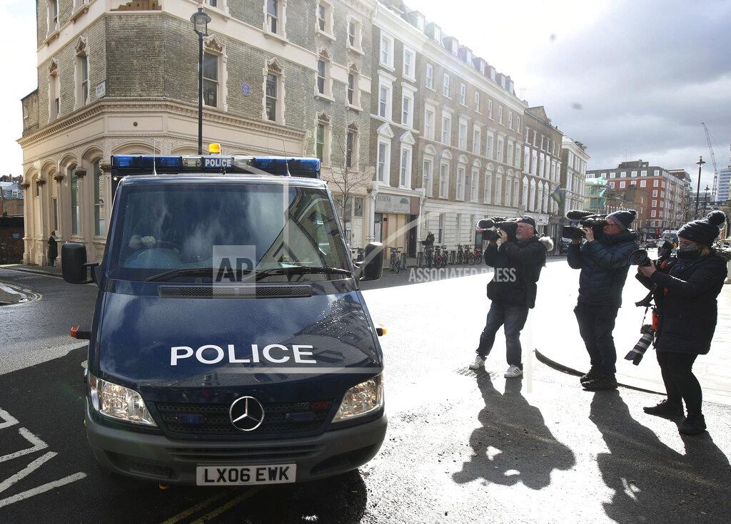 Steve Parsons A police van arrives at Westminster Magistrates' Court, in London, Saturday March 13, 2021. London police arrested a member of the force's Parliamentary and Diplomatic Protection Command on Tuesday as a suspect in the case of the disappearance of Sarah Everard. Late Friday police charged the officer, Constable Wayne Couzens, with kidnapping and murder. Couzens, 48, was due to appear in court on Saturday. (Steve Parsons/PA via AP)