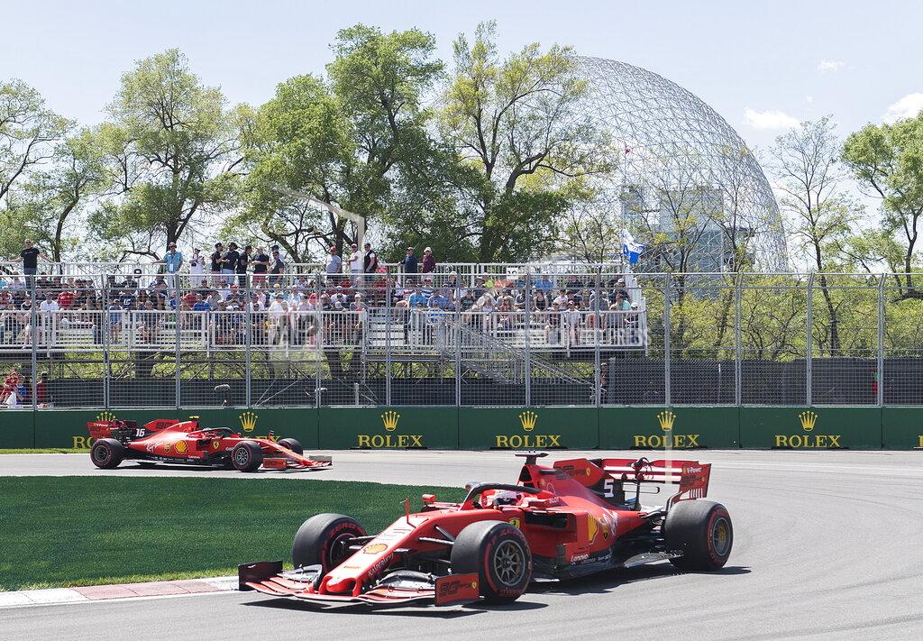 Graham Hughes Ferrari drivers Charles Leclerc of Monaco, left, and Sebastian Vettel of Germany drive through the hairpin during the second practice session at the Formula One Canadian Grand Prix auto race, Friday, June 7, 2019, in Montreal. (Graham Hughes/The Canadian Press via AP)