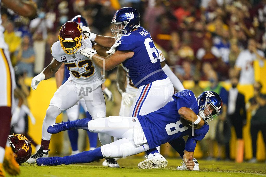 Al Drago New York Giants quarterback Daniel Jones (8) scores a touchdown against the Washington Football Team during the first half of an NFL football game, Thursday, Sept. 16, 2021, in Landover, Md. (AP Photo/Al Drago)