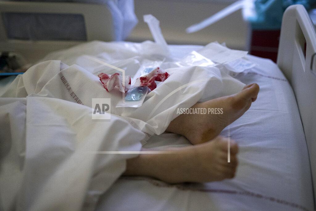 Daniel Cole Bandages are discarded as nurses tend to an intubated patient suffering from COVID-19 in the ICU at the La Timone hospital in Marseille, southern France, Tuesday Feb. 2, 2021. COVID patients occupy 88% of the Marseille region's intensive care beds, and virus pressure on French hospitals is steadily rising in recent weeks despite curfews and other restrictions. (AP Photo/Daniel Cole)