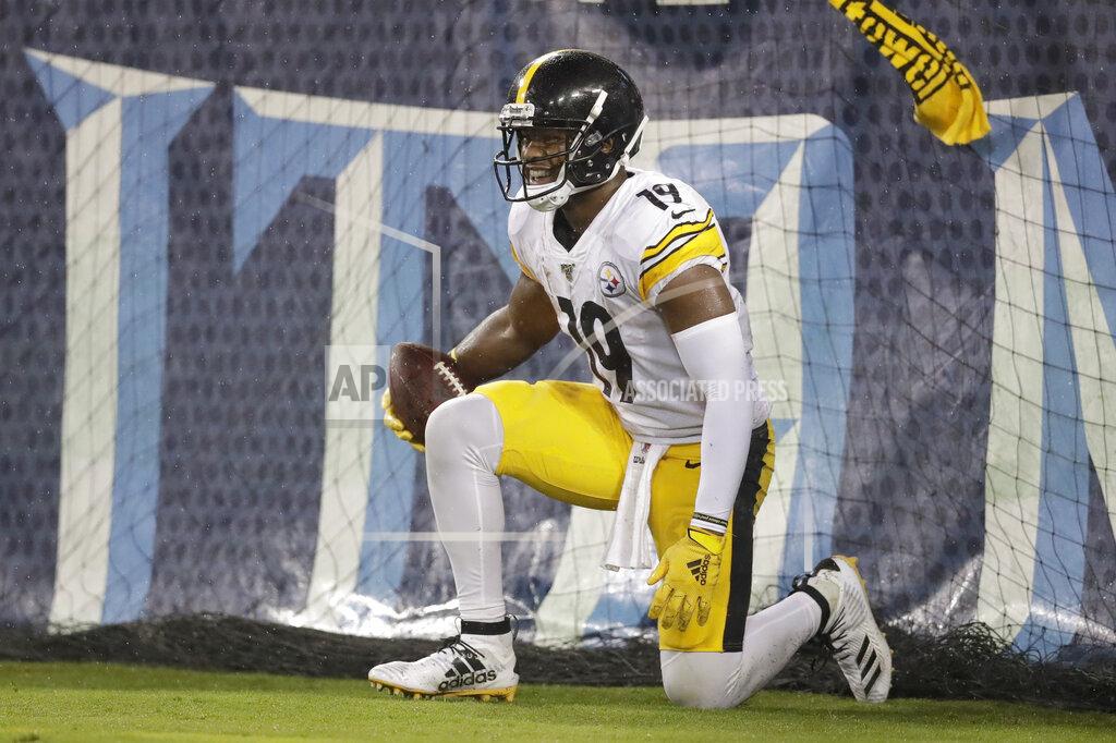 James Kenney Pittsburgh Steelers wide receiver JuJu Smith-Schuster gets up after catching a 17-yard touchdown pass against the Tennessee Titans in the first half of a preseason NFL football game Sunday, Aug. 25, 2019, in Nashville, Tenn. (AP Photo/James Kenney)