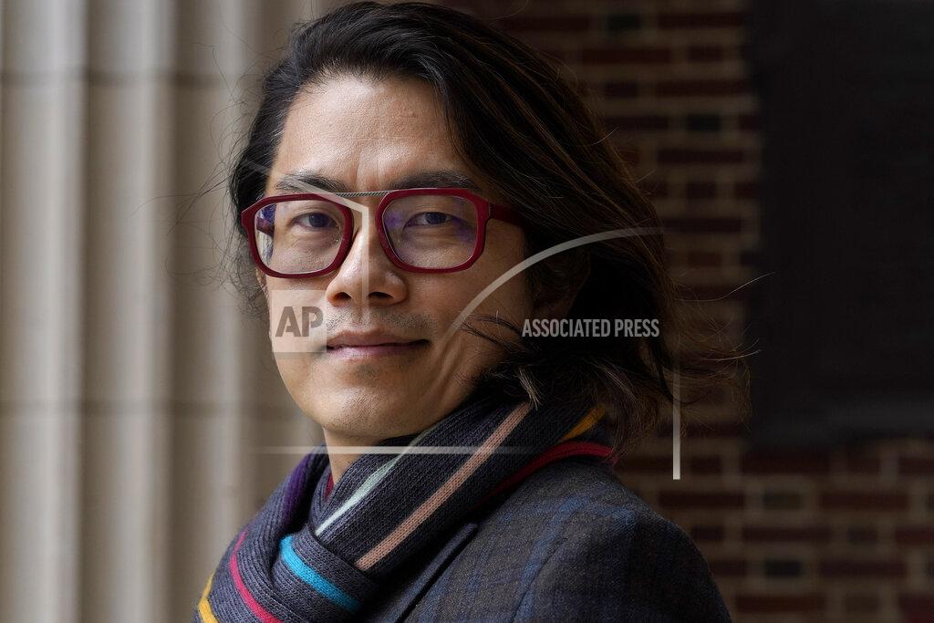 Steven Senne Eng-Beng Lim, a professor at Dartmouth College, stands for a photograph on the school's campus, Tuesday, April 20, 2021, in Hanover, N.H. A wave of anti-Asian attacks that started more than a year ago with the pandemic, along with the March 2021 shootings in Atlanta that left six Asian women dead, have provoked national conversations about the visibility of Asian Americans. (AP Photo/Steven Senne)